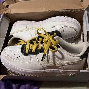 White and Yellow Sneakers with Black Accents